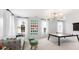 Recreation room featuring a ping pong table, comfortable sofa, and bright decor for casual entertaining at 1441 Clay Field Trl, Summerville, SC 29485