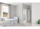 Cozy bedroom features neutral colors, large window and a convenient trundle bed with built-in drawers at 1441 Clay Field Trl, Summerville, SC 29485