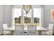 Elegant dining room featuring a modern chandelier and large windows offering lots of natural light at 1441 Clay Field Trl, Summerville, SC 29485