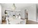 Open-concept living and dining area with stylish chandelier and hardwood flooring, perfect for entertaining at 1441 Clay Field Trl, Summerville, SC 29485