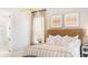 Serene main bedroom with a woven headboard, soft lighting, and an en-suite bathroom with a glass shower at 1441 Clay Field Trl, Summerville, SC 29485