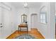 Bright and inviting foyer featuring hardwood floors, stylish décor, and ample natural light at 150 Etiwan Park St, Charleston, SC 29492