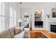 Living room showcasing a fireplace, built-in shelving, comfortable seating, and abundant natural light at 150 Etiwan Park St, Charleston, SC 29492