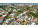 Expansive aerial view of a neighborhood with a mix of historic homes and lush trees, showcasing a vibrant cityscape at 157 Tradd St, Charleston, SC 29401