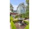Backyard featuring stone water fountain and lush greenery at 157 Tradd St, Charleston, SC 29401