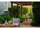Inviting backyard with lush greenery and a charming table setting, ideal for outdoor entertaining at 157 Tradd St, Charleston, SC 29401