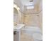Bright bathroom featuring a tiled bathtub and shower combination with a pedestal sink and modern fixtures at 157 Tradd St, Charleston, SC 29401