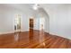 Spacious bedroom with hardwood floors leading to a bathroom, closet, and hallway at 157 Tradd St, Charleston, SC 29401