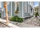 Charming home showcasing flower boxes, lush plants and brick sidewalk at 157 Tradd St, Charleston, SC 29401