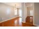 Spacious room with hardwood floors and French doors to the outside at 157 Tradd St, Charleston, SC 29401