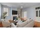 Cozy living room with fireplace, TV, hardwood floors, and comfortable furniture at 157 Tradd St, Charleston, SC 29401