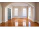 Spacious room with hardwood floors, large windows and arched doorways at 157 Tradd St, Charleston, SC 29401