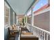 Inviting covered porch featuring comfortable seating and classic architectural details at 157 Tradd St, Charleston, SC 29401