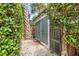 Backyard shed with lush greenery, offering a private and peaceful outdoor space at 157 Tradd St, Charleston, SC 29401