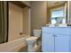 Bathroom featuring a tub/shower combo, toilet, vanity, tile flooring, and neutral wall paint at 170 Collared Dove Ct, Summerville, SC 29483