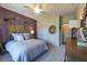 Bedroom featuring a full bed, ceiling fan, nightstand, closet, and decorative wall art at 170 Collared Dove Ct, Summerville, SC 29483