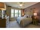 Cozy bedroom with king bed, natural light and complementary furniture at 170 Collared Dove Ct, Summerville, SC 29483