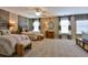 Spacious bedroom with natural light, two beds, ceiling fan and neutral color palette at 170 Collared Dove Ct, Summerville, SC 29483