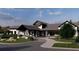 Attractive clubhouse exterior with stone accents and a covered entrance, showcasing a welcoming community hub at 170 Collared Dove Ct, Summerville, SC 29483