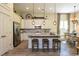 Bright kitchen featuring an island with seating, stainless appliances, and stylish pendant lights at 170 Collared Dove Ct, Summerville, SC 29483
