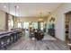 Open living space with modern furniture, hardwood floors, and an eat-in kitchen with barstool seating at 170 Collared Dove Ct, Summerville, SC 29483