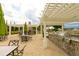 Outdoor kitchen and seating area featuring a pergola, stainless steel grill, and brick accents at 170 Collared Dove Ct, Summerville, SC 29483