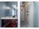 A modern bathroom with glass enclosed shower, stylish vanity and great lighting at 182 E Bay St # 303, Charleston, SC 29401