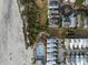 Overhead view captures a beachside community with a pool, boardwalk, and various home styles at 19 Grand Pavilion Blvd, Isle of Palms, SC 29451