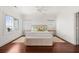 Bright bedroom with wood floors, large windows, ceiling fan and beach decor at 19 Grand Pavilion Blvd, Isle of Palms, SC 29451