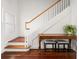 Entryway with staircase, wooden table and hardwood floors at 19 Grand Pavilion Blvd, Isle of Palms, SC 29451