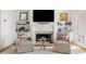 Cozy living room with a fireplace, built-in shelving, and comfortable seating at 19 Grand Pavilion Blvd, Isle of Palms, SC 29451