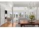 Bright open-plan living space featuring hardwood floors and balcony access with beautiful ocean views at 19 Grand Pavilion Blvd, Isle of Palms, SC 29451