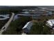 Aerial view of a beautiful home nestled among trees, showcasing its architectural design and scenic waterfront location at 2101 Guerins Bridge Rd, Wando, SC 29492