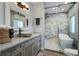 Modern bathroom features a unique vessel sink, stylish lighting, and a luxurious glass-enclosed shower and tub at 2101 Guerins Bridge Rd, Wando, SC 29492