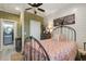 Serene bedroom with stylish decor, featuring wood plank walls, a plush bed, and a view of the modern bathroom at 2101 Guerins Bridge Rd, Wando, SC 29492