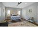 Bright bedroom features a ceiling fan, wood floors, and modern decor for a serene and inviting atmosphere at 2101 Guerins Bridge Rd, Wando, SC 29492