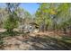 The backyard has a chicken coop with chairs in the foreground at 2101 Guerins Bridge Rd, Wando, SC 29492