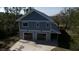 Exterior of home features garage and blue siding with lush green surroundings at 2101 Guerins Bridge Rd, Wando, SC 29492