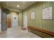 Hallway with wood paneling, wood flooring, and wooden bench at 2101 Guerins Bridge Rd, Wando, SC 29492