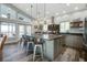 Modern kitchen with a large island, stainless steel appliances, custom cabinetry, and a breakfast bar at 2101 Guerins Bridge Rd, Wando, SC 29492