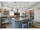 Modern kitchen with a large island, stainless steel appliances, custom cabinetry, and a breakfast bar at 2101 Guerins Bridge Rd, Wando, SC 29492