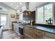 Well-equipped kitchen with stainless steel appliances, black countertops, and decorative backsplash adding elegance and functionality at 2101 Guerins Bridge Rd, Wando, SC 29492