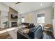 Cozy living room with a fireplace, comfortable seating, and natural light, creating an inviting atmosphere at 2101 Guerins Bridge Rd, Wando, SC 29492