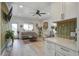 Inviting living room with shiplap wall, neutral tones, lots of plants, and bright natural light at 2101 Guerins Bridge Rd, Wando, SC 29492