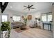Bright living room featuring hardwood floors, a ceiling fan, comfortable seating and modern decor at 2101 Guerins Bridge Rd, Wando, SC 29492