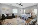 Stylish main bedroom offering a relaxing ambiance with a comfortable seating area and natural light at 2101 Guerins Bridge Rd, Wando, SC 29492