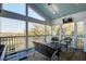 Relaxing screened porch with comfortable seating and stunning views of the marsh and surrounding nature at 2101 Guerins Bridge Rd, Wando, SC 29492