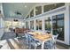 Spacious screened porch with expansive views and a table, perfect for enjoying the outdoors at 2101 Guerins Bridge Rd, Wando, SC 29492