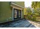 Wooden deck with railing provides an outdoor space for relaxing and entertaining at 2101 Heavens Way, Summerville, SC 29483