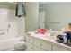 Cluttered bathroom featuring a white vanity, tile floors, and a shower-tub combination at 2101 Heavens Way, Summerville, SC 29483